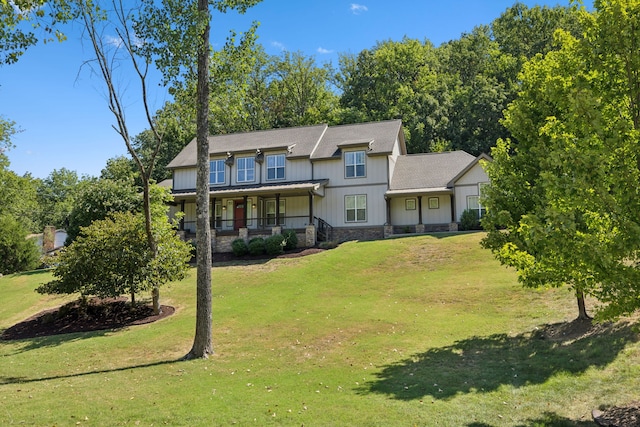 view of front of house featuring a front yard and a porch