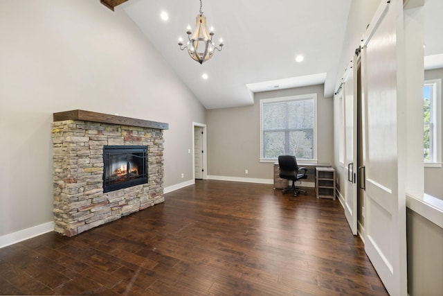 unfurnished office with an inviting chandelier, dark wood-type flooring, a stone fireplace, high vaulted ceiling, and baseboards