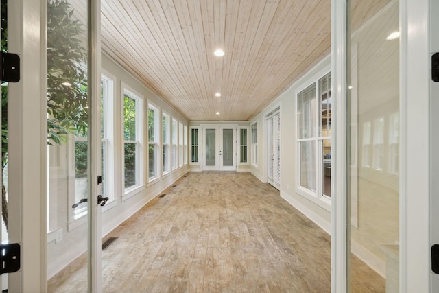 unfurnished sunroom featuring wood ceiling and visible vents