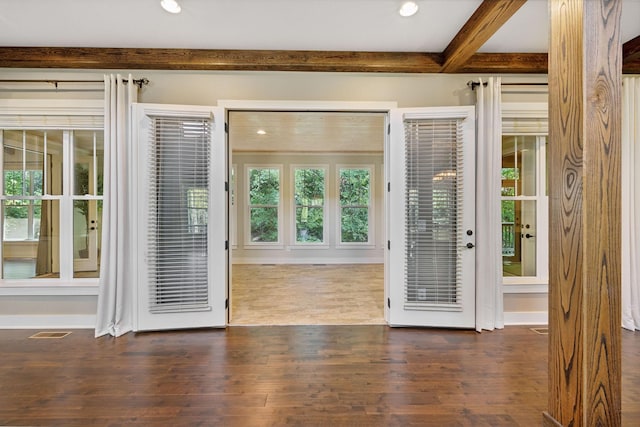 doorway to outside with dark wood-style flooring, beam ceiling, recessed lighting, visible vents, and baseboards