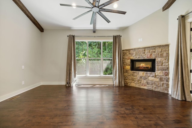 unfurnished living room with a fireplace, dark wood finished floors, a ceiling fan, and baseboards