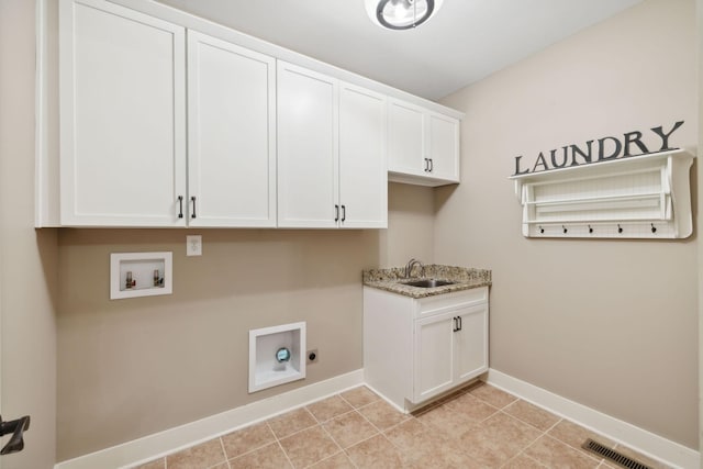 laundry room featuring hookup for an electric dryer, washer hookup, visible vents, baseboards, and cabinet space