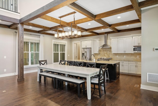 dining room featuring beam ceiling, coffered ceiling, and dark wood finished floors