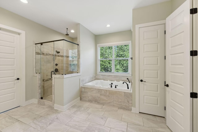 bathroom with a garden tub, baseboards, a shower stall, and recessed lighting