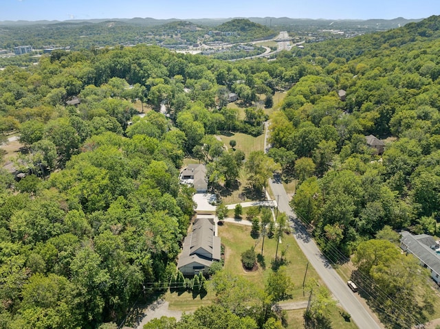 bird's eye view featuring a wooded view