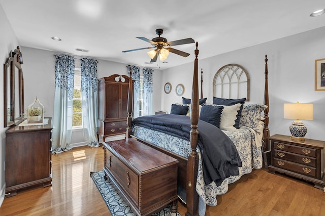 bedroom with ceiling fan and light hardwood / wood-style flooring