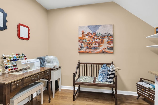 home office with hardwood / wood-style flooring and lofted ceiling