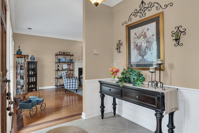 entrance foyer with wood-type flooring and ornamental molding