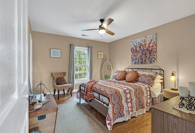 bedroom with ceiling fan and light hardwood / wood-style flooring