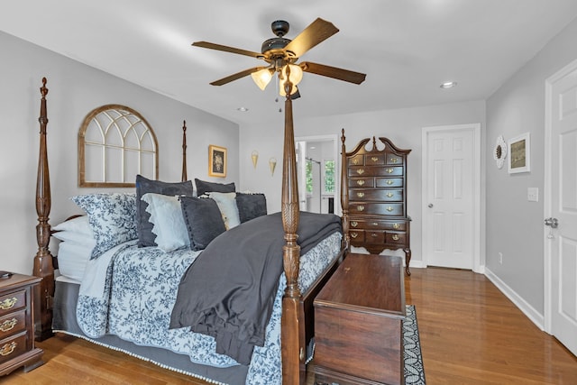 bedroom featuring ceiling fan and hardwood / wood-style flooring