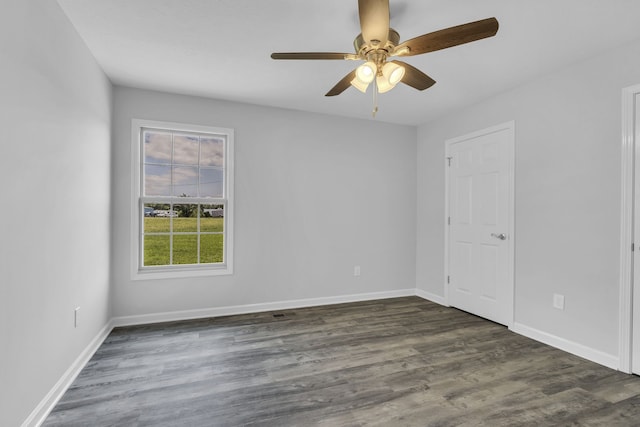 empty room featuring ceiling fan and wood-type flooring