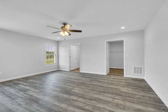 spare room with hardwood / wood-style floors and ceiling fan