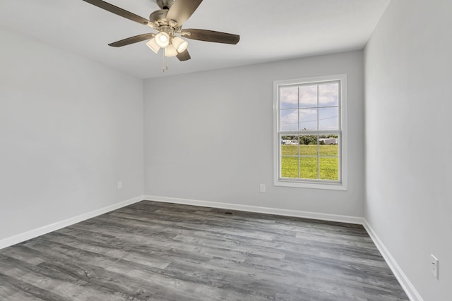 empty room featuring ceiling fan and hardwood / wood-style flooring