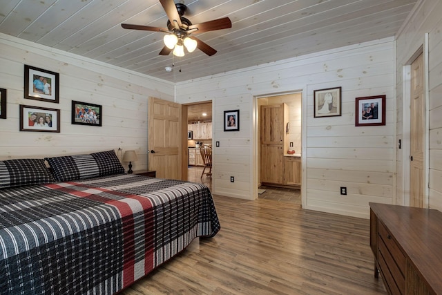 bedroom featuring ceiling fan, wood-type flooring, and wooden ceiling