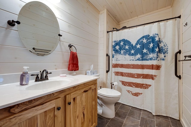 bathroom with wooden walls, vanity, wood ceiling, and toilet