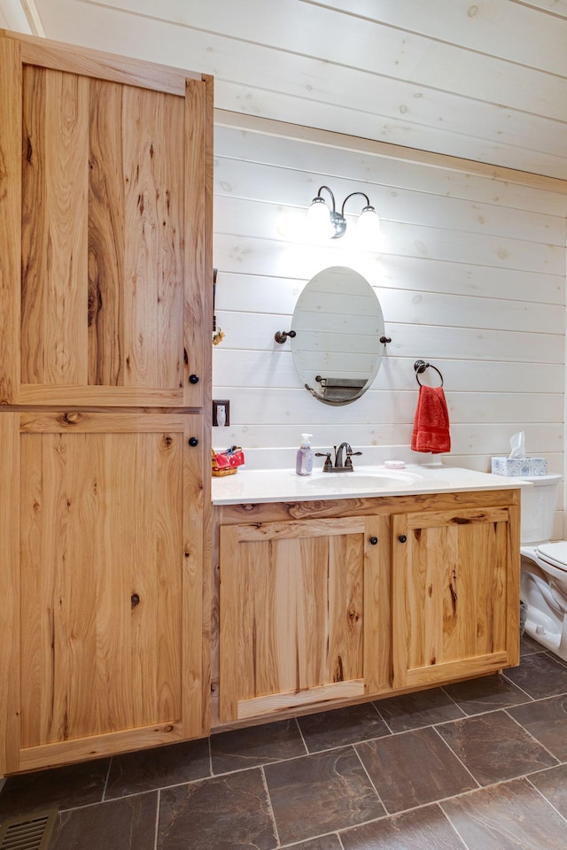 bathroom with vanity and toilet