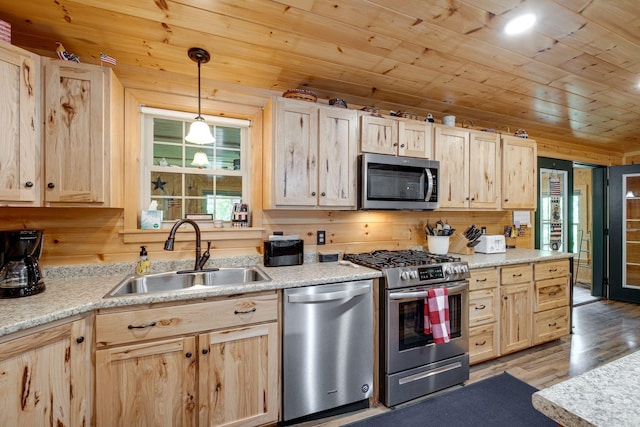 kitchen featuring appliances with stainless steel finishes, sink, wood ceiling, and light brown cabinets