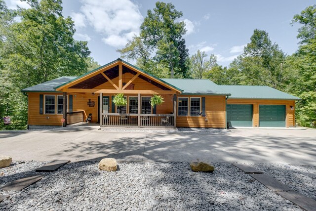 view of front of home with a garage and a porch