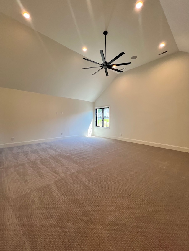 carpeted empty room featuring lofted ceiling and ceiling fan