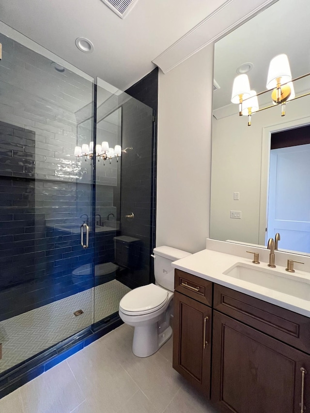 bathroom with vanity, visible vents, tile patterned flooring, a shower stall, and toilet