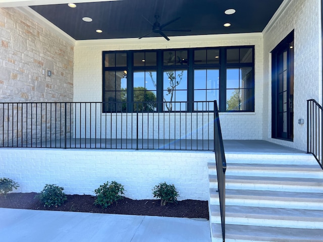 doorway to property with ceiling fan