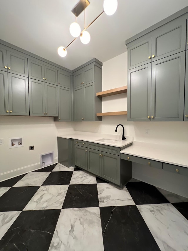 kitchen with light stone counters, open shelves, a sink, hanging light fixtures, and marble finish floor