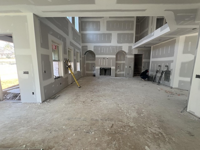 unfurnished living room featuring a fireplace