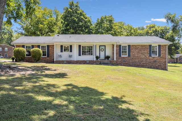 single story home featuring a front yard