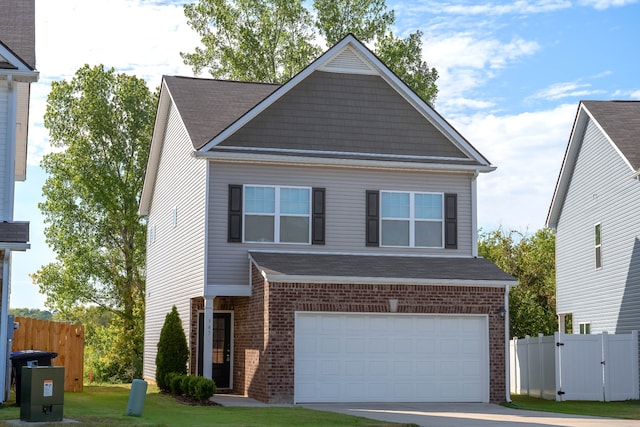 view of front of house with a garage and a front lawn