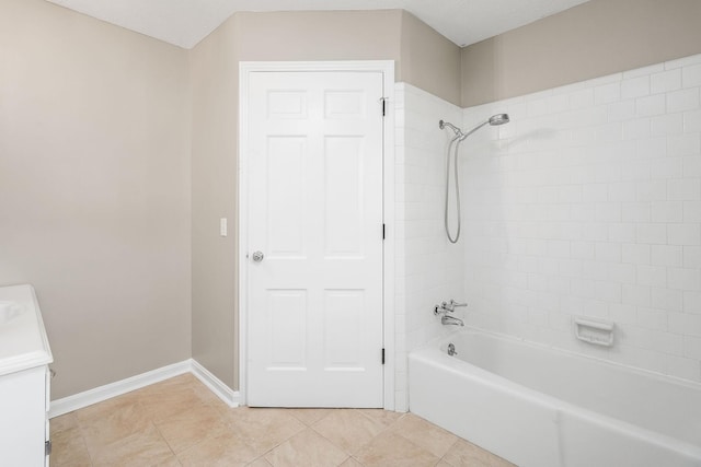 full bath featuring shower / washtub combination, tile patterned flooring, vanity, and baseboards