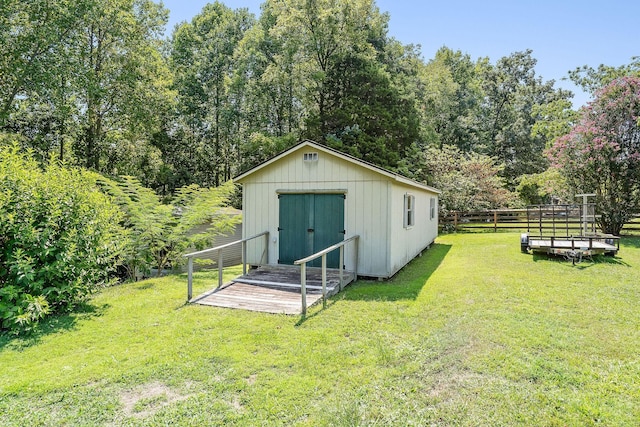 view of shed featuring fence