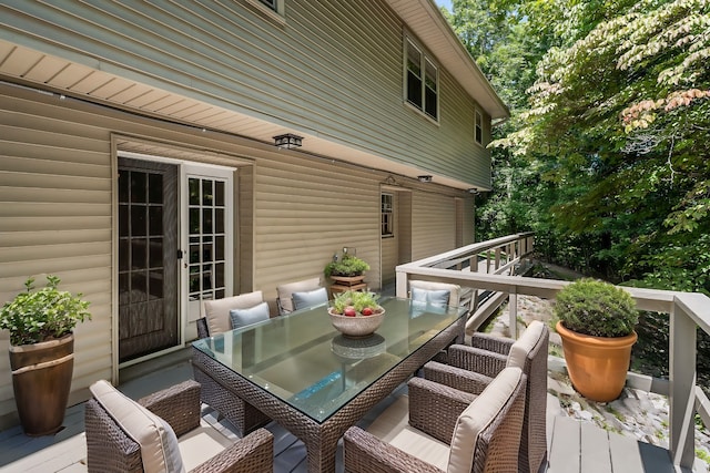 wooden deck with outdoor dining area