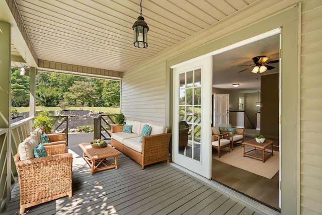 wooden deck with an outdoor living space