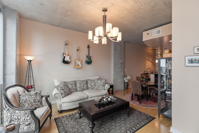 living room featuring light hardwood / wood-style flooring and a chandelier