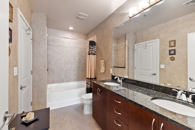 full bathroom featuring tile patterned flooring, toilet, shower / bath combo with shower curtain, and vanity