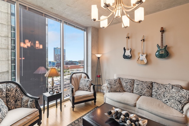 living room featuring a notable chandelier, floor to ceiling windows, and light hardwood / wood-style floors