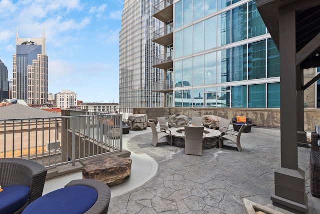 view of patio featuring outdoor lounge area and a balcony