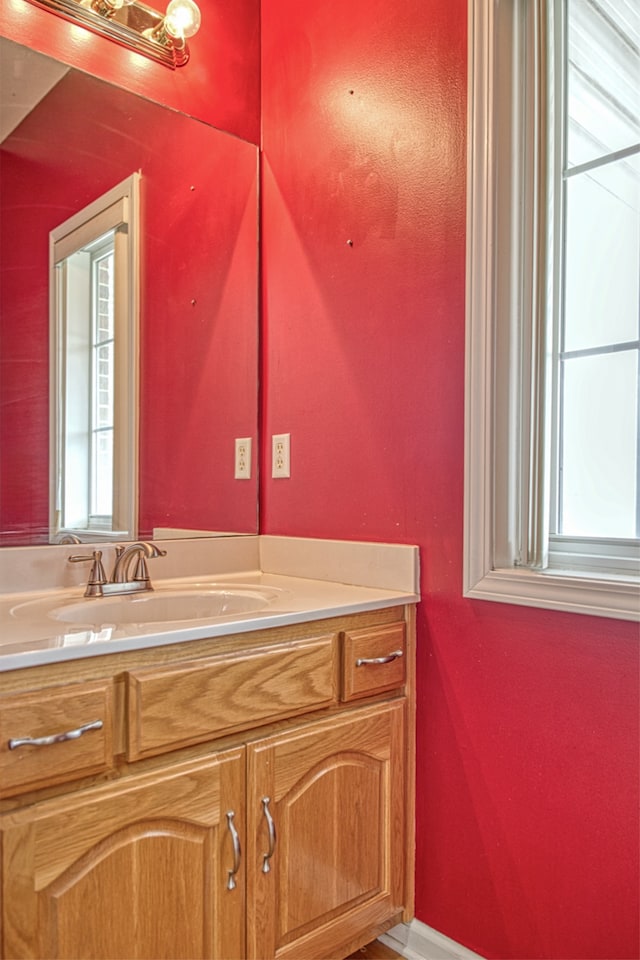 bathroom with a healthy amount of sunlight and vanity