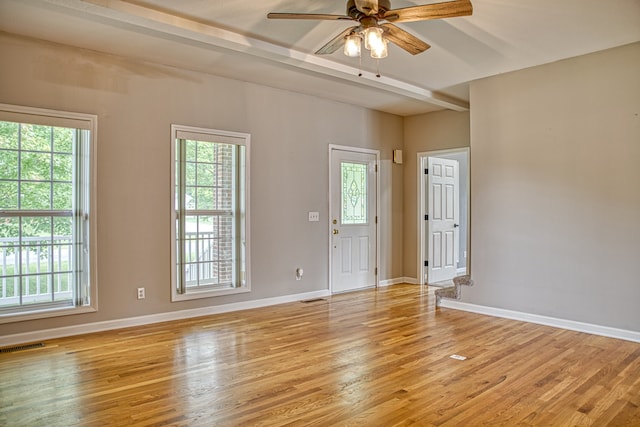 unfurnished room featuring light wood-type flooring and ceiling fan