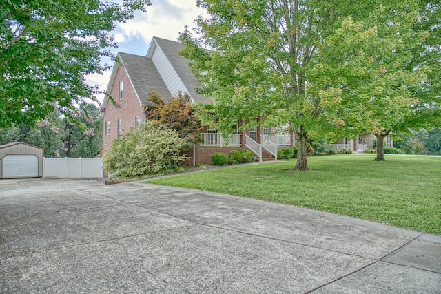 view of front of home with a garage and a front lawn