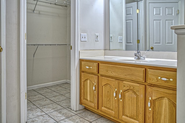 bathroom with vanity and tile patterned flooring