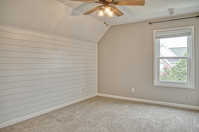 additional living space featuring lofted ceiling, carpet flooring, and ceiling fan