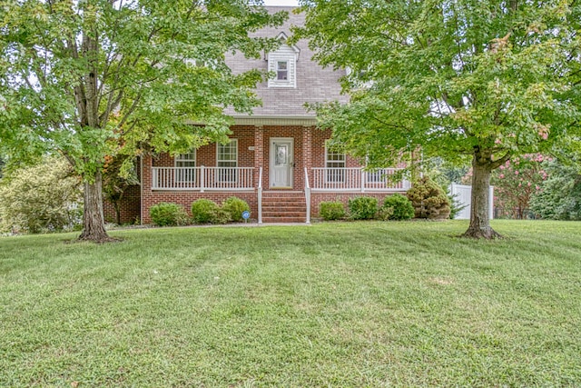 view of front facade with a front yard and a porch