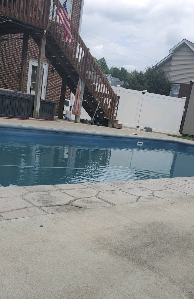 view of swimming pool featuring a patio