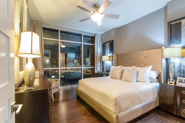 bedroom featuring dark wood finished floors