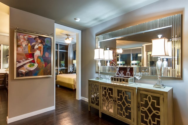 interior space with dark wood-style floors and baseboards