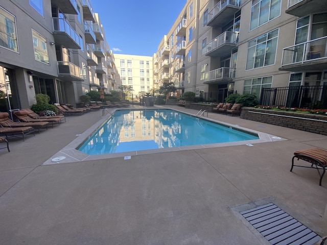 view of pool featuring a patio