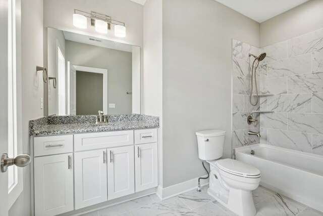 full bathroom with toilet, tiled shower / bath combo, vanity, and tile patterned floors