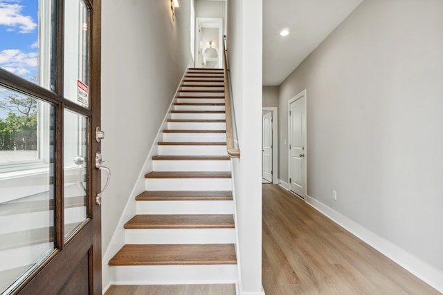 stairs with wood-type flooring