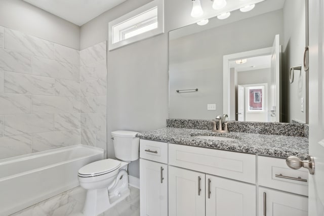 full bathroom with toilet, tiled shower / bath combo, vanity, and tile patterned floors